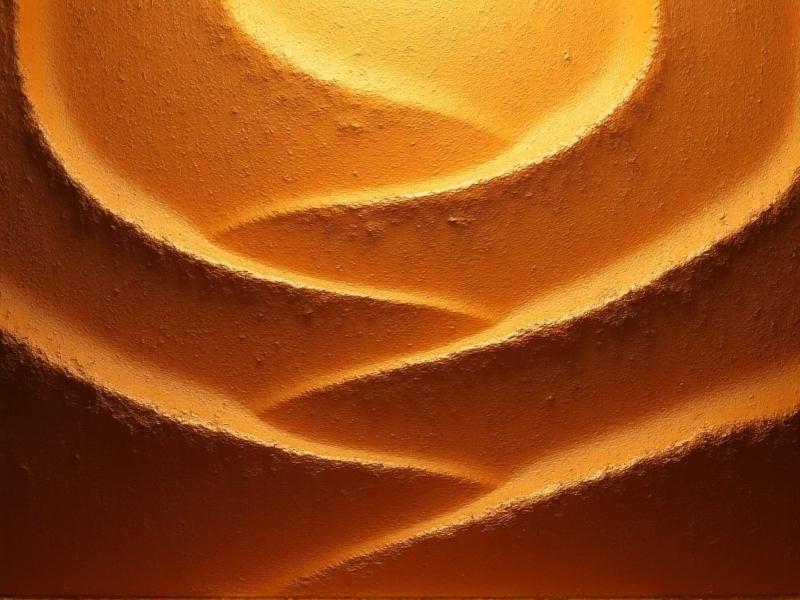 Macro photograph of a clay-painted wall showing intricate, undulating textures resembling desert dunes. The surface transitions from deep sienna to golden highlights under directional lighting, creating a three-dimensional, almost sculptural effect.